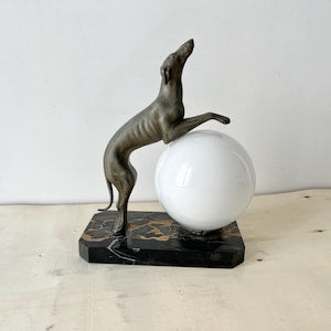The joyful greyhound in marble and spelter, art deco lighting